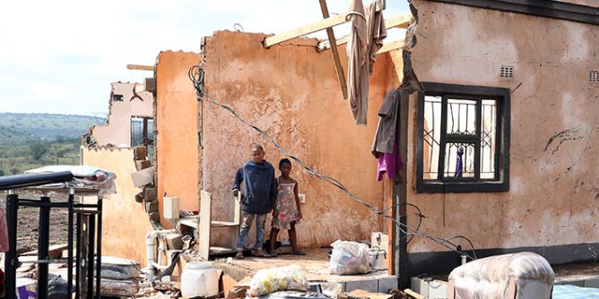 Bandile and Asanda Xulu outside their grandmother's home in eMpolweni, near Pietermaritzburg, which collapsed after being hit by a tornado in November.